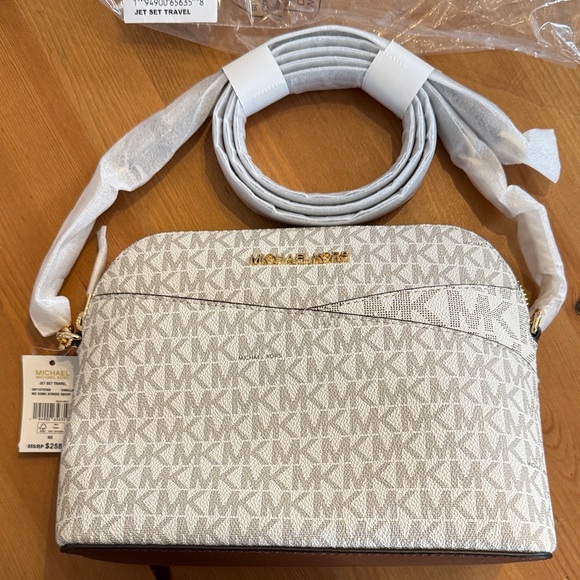 Michael Kors Handbags - NWT! Jet Set Travel Medium Logo Dome Crossbody Bag